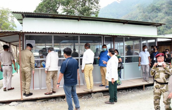 Ministers inspect newly laid pre-fabricated screening structure at Melli